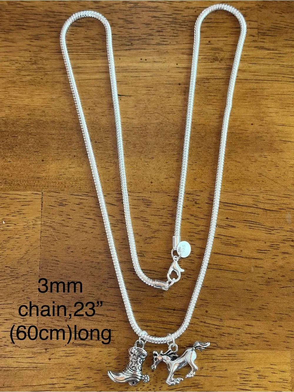 925 sterling silver necklace.23”snake chain,running horse & cowboy boot pendants
